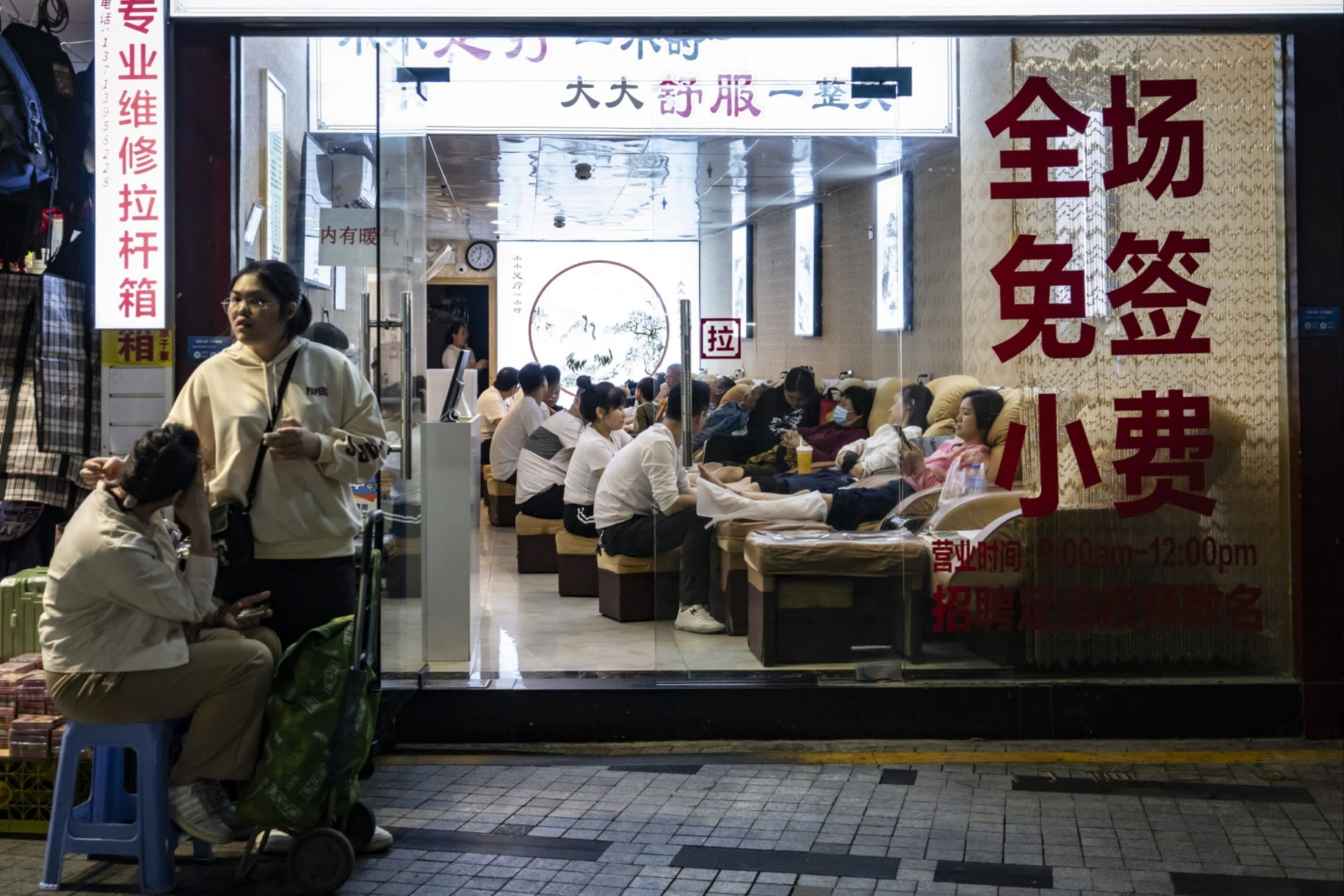 Customers have pedicures at a store in the south-eastern city of Shenzhen
