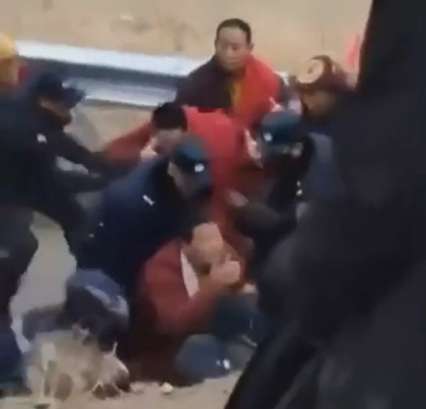 ENG_TIB_ArrestsReax_02262024.2.1.jpg Chinese authorities arrest Tibetan monks during a protest against a dam project on the Drichu River in Dege county, southwestern China's Sichuan province, Feb. 22, 2024. (Image from citizen journalist video)