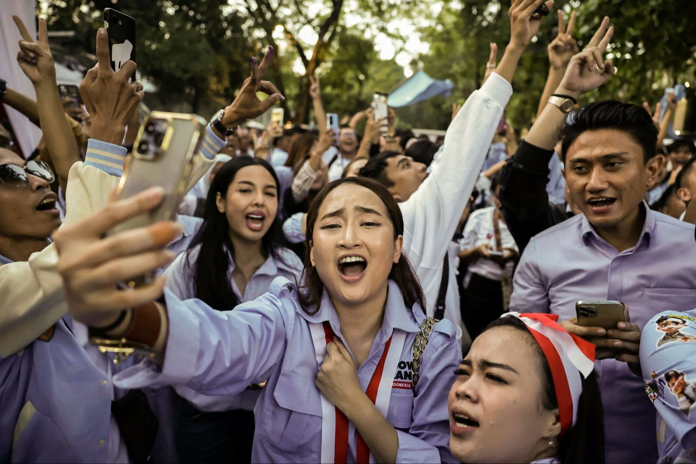 Supporters gathered outside Prabowo Subianto’s home after polls closed in Jakarta on Wednesday