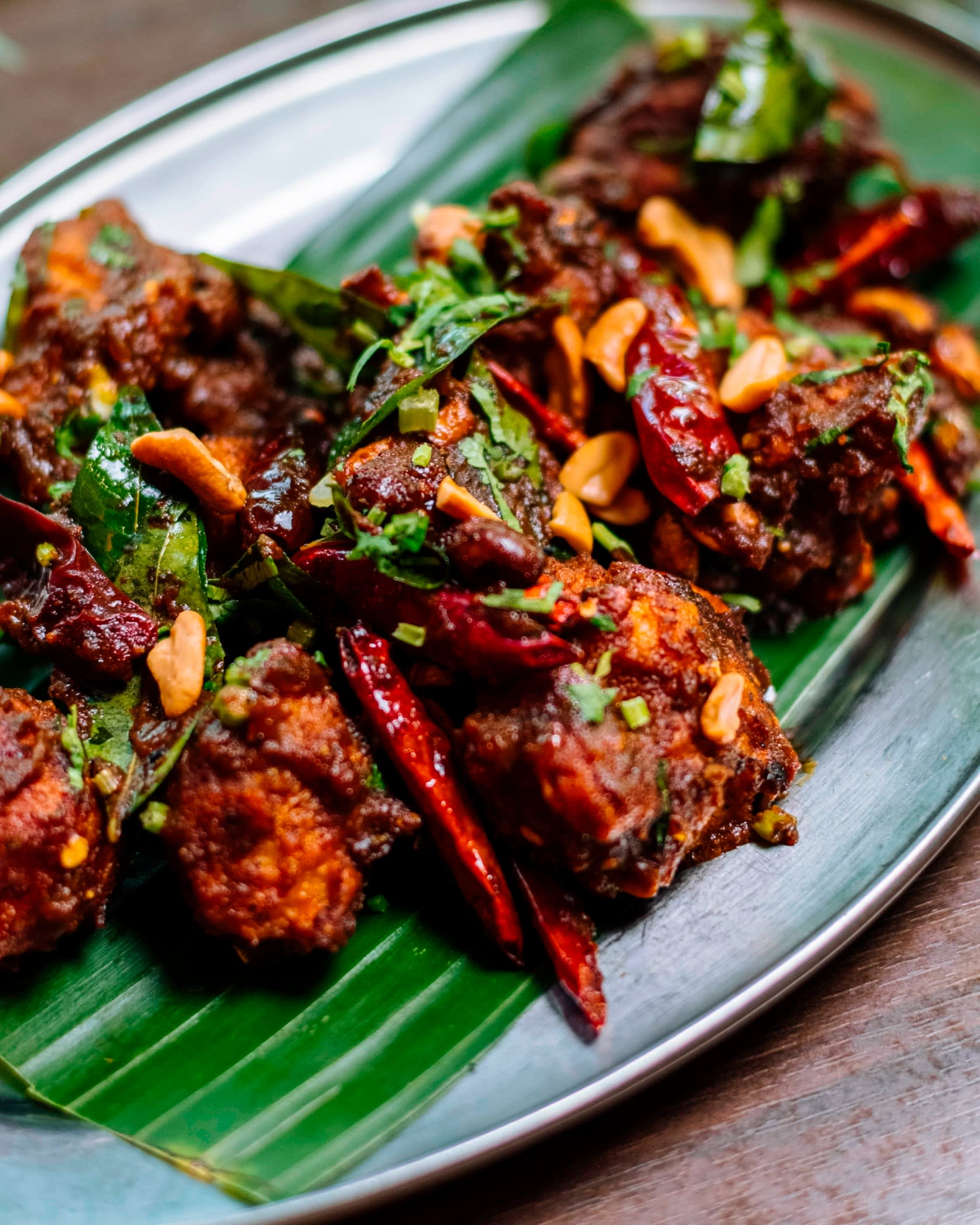 Urval chicken tossed with curry leaves and cashews at Bangera’s Kitchen Ginza