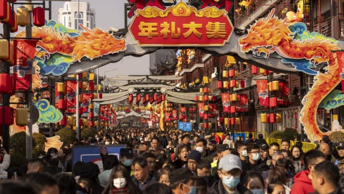 People walk through Yuyuan Bazaar in Shanghai. To encourage domestic spending, the government may need to deploy a fiscal stimulus of 2% of GDP or more