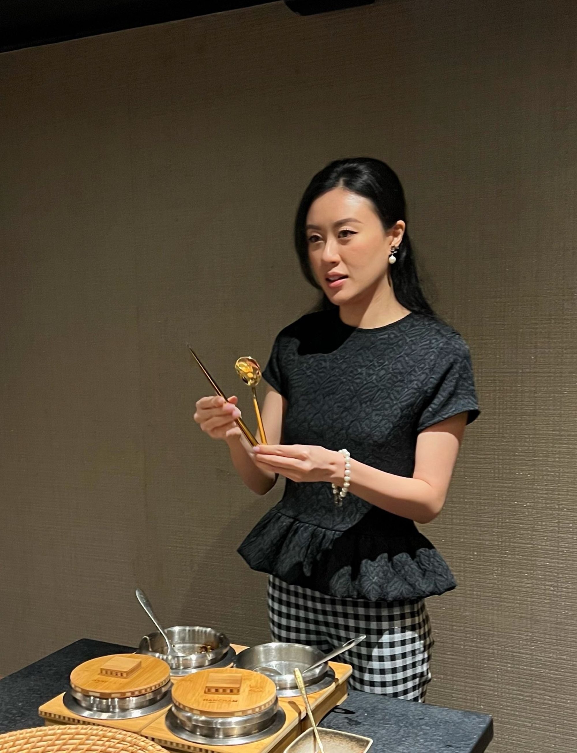 Piano Mok explains how Korean table settings feature chopsticks and an elongated spoon, which is used to eat rice and stew. Photo: Piano Mok