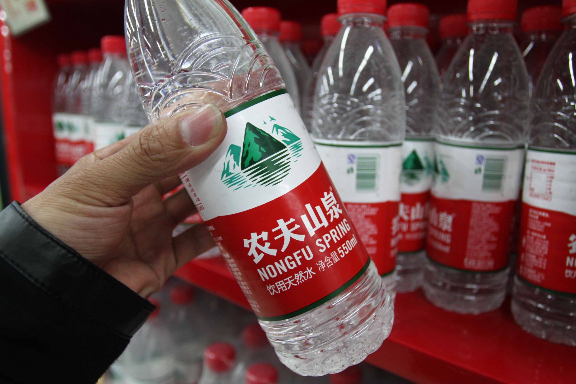 Bottles of Nongfu Spring water are seen in a supermarket in Xuchang, Henan province, China. File photo: Imaginechina via AFP