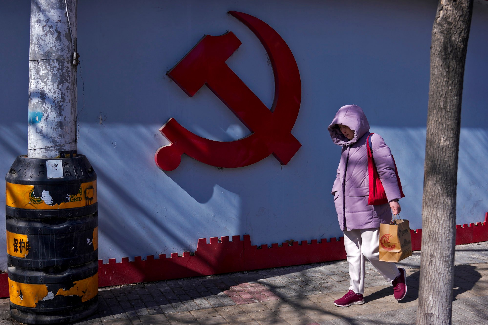 A Communist Party logo seen near a residential area in Beijing. Photo: AP Photo