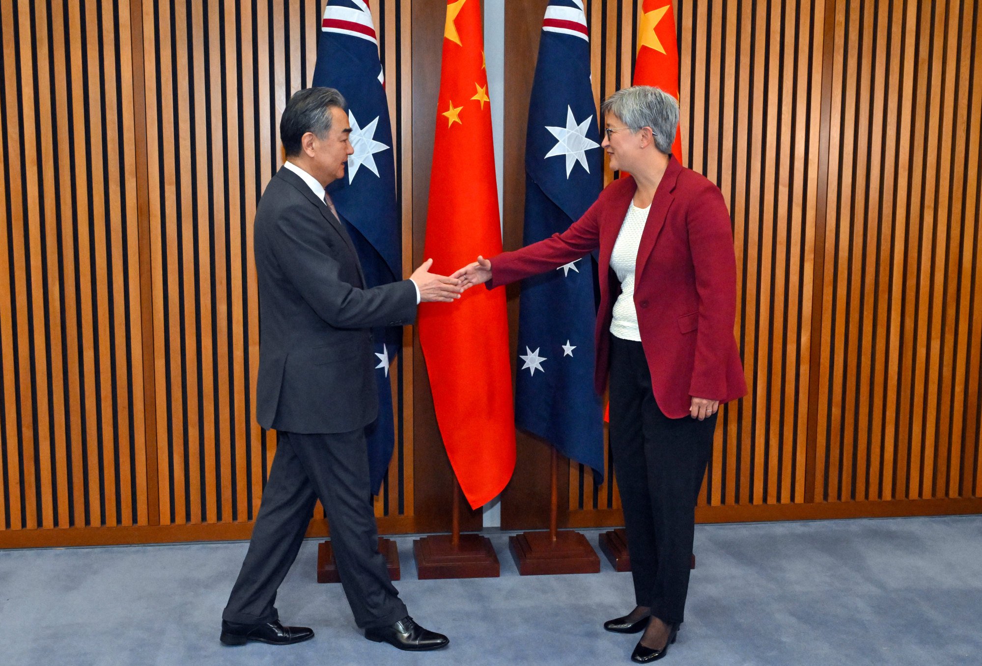 Australian Foreign Minister Penny Wong greets her Chinese counterpart Wang Yi in Canberra. Photo: AP