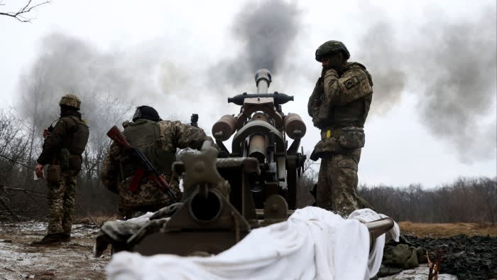 Smoke rises as artillery troops fire the weapon