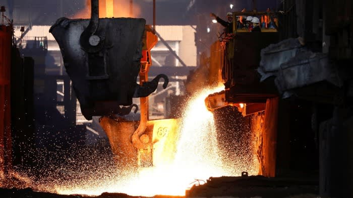 Workers monitoring the nickel melting process at a smelter in Indonesia