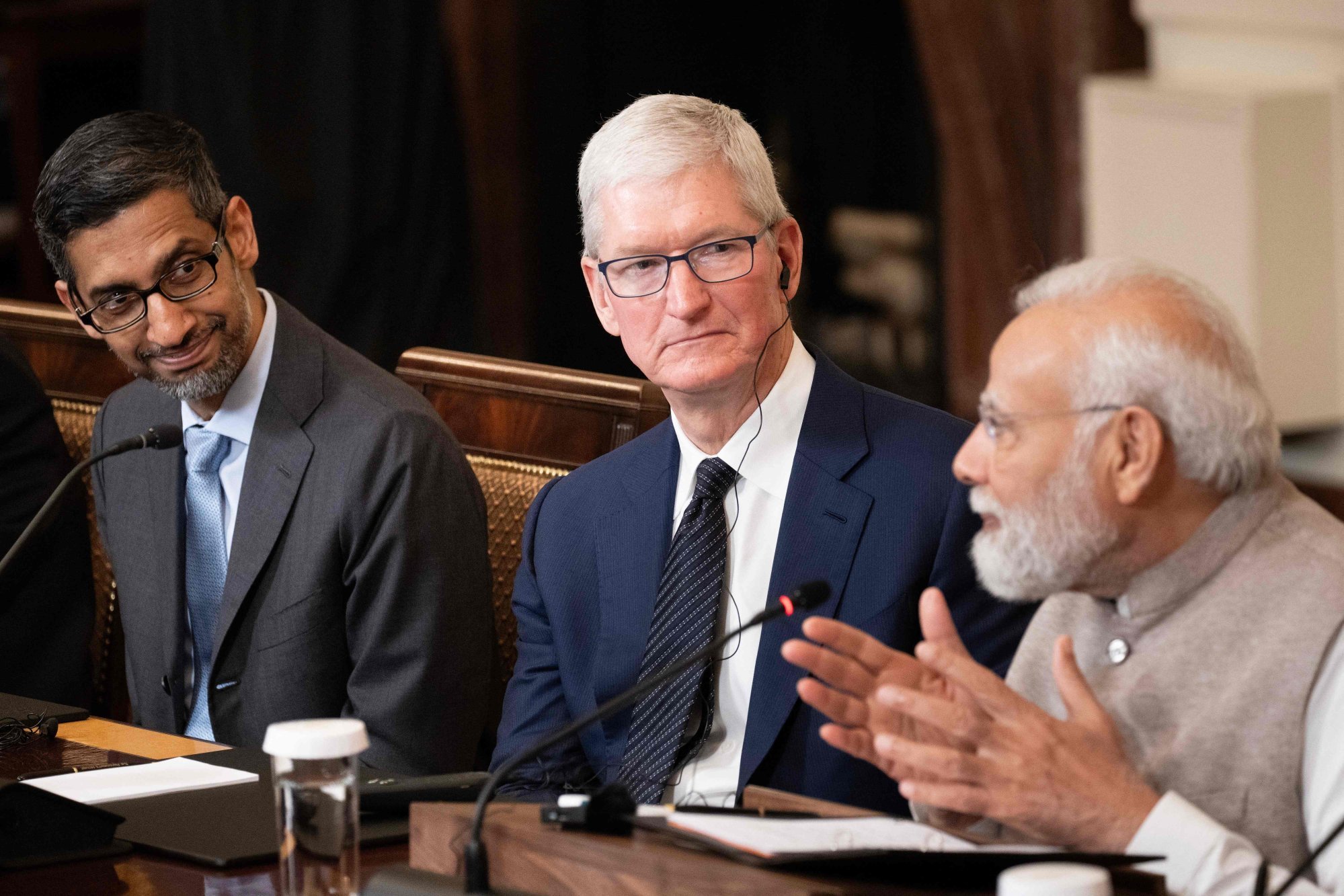 Google CEO Sundar Pichai and Apple CEO Tim Cook look on as Indian Prime Minister Narendra Modi speaks during a meeting with senior officials and CEOs in the East Room the White House on June 23, 2023. Photo: AFP