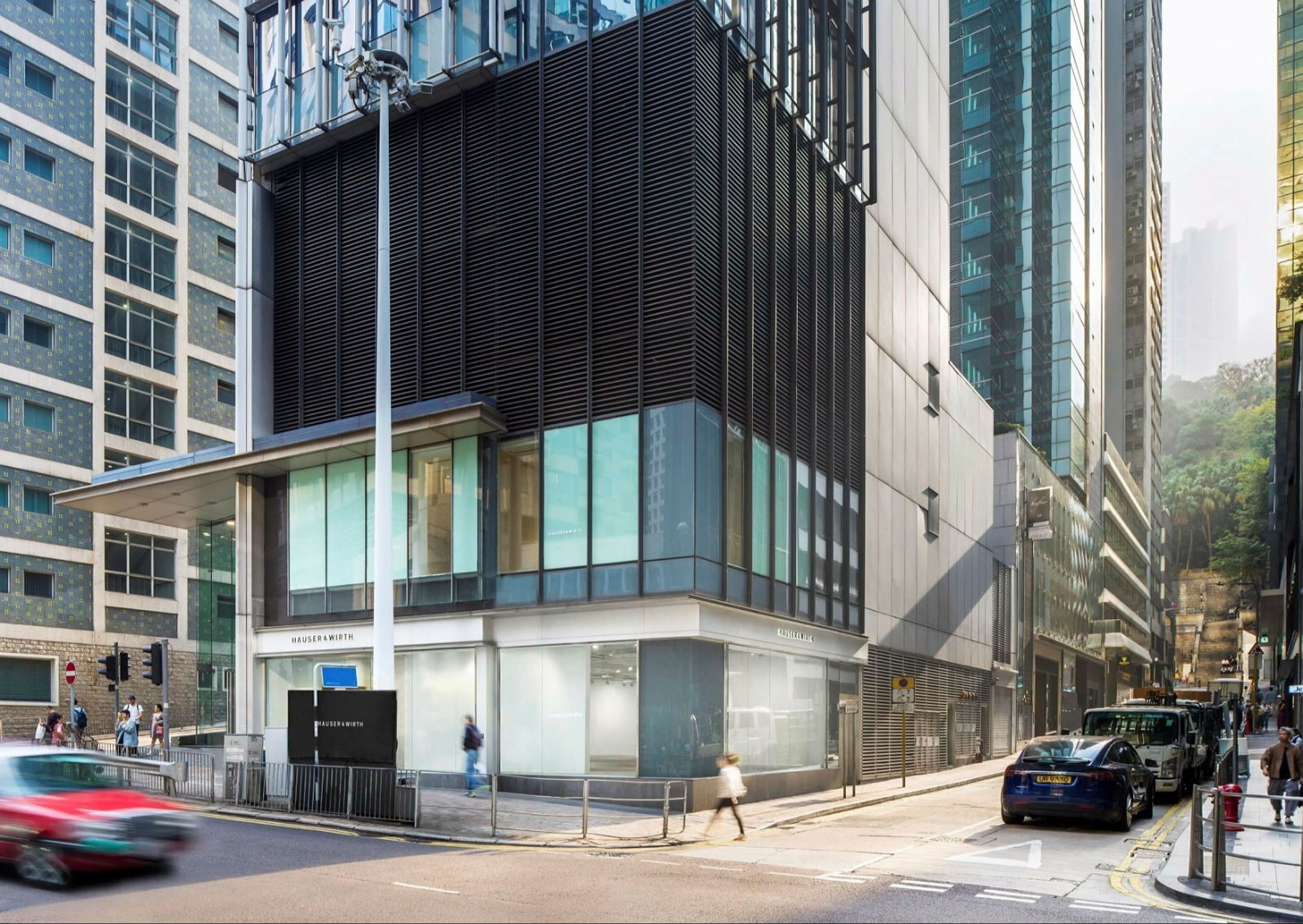 A building with latticed steelwork on a street corner