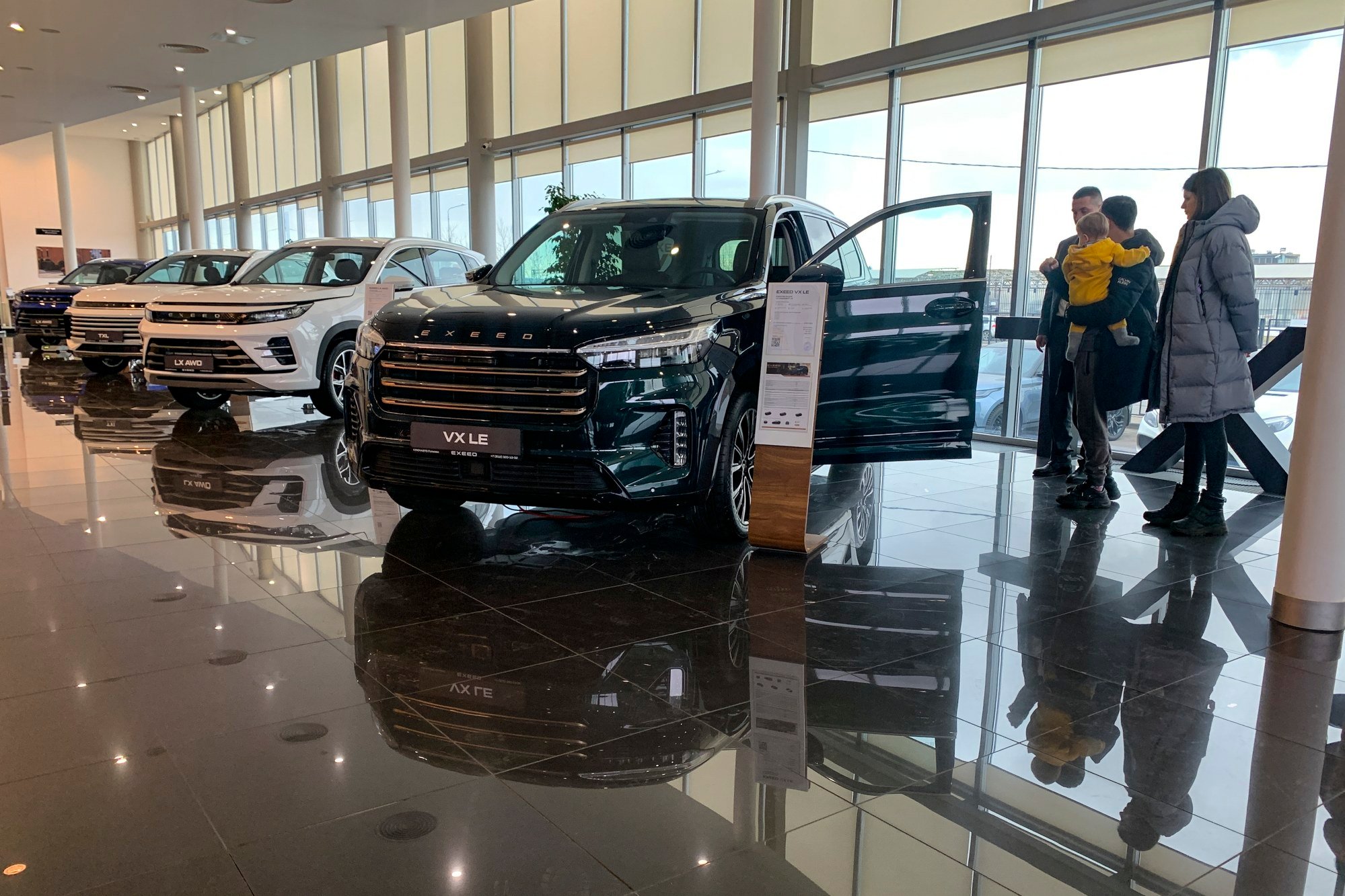 People look at vehicles at a car showroom in St. Petersburg, Russia on March 9, 2024. Photo: AP