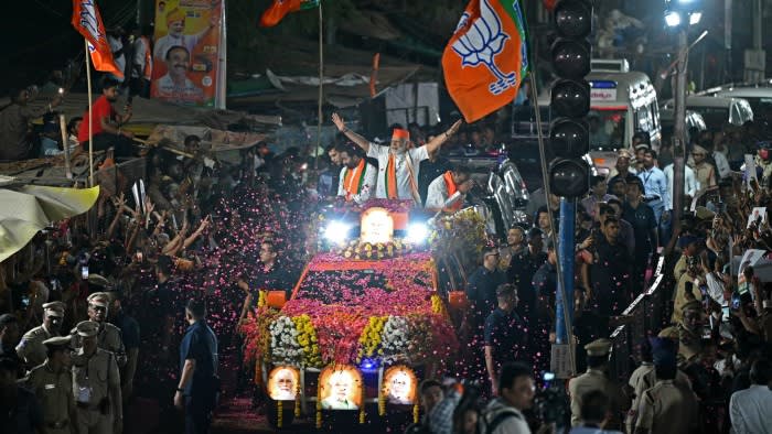 Narendra Modi waves to supporters in Hyderabad