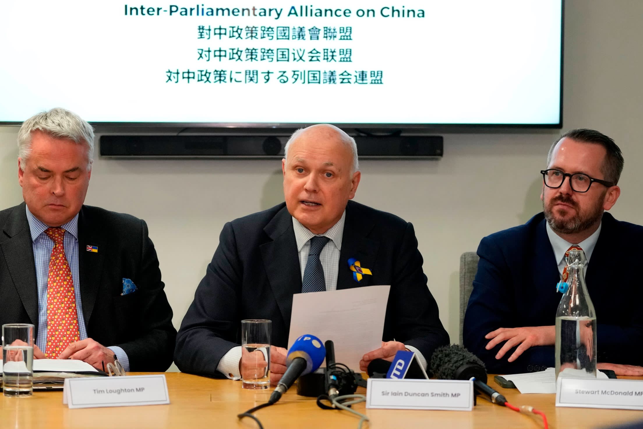 Sir Ian Duncan Smith, centre, and fellow members of the hawkish Inter-Parliamentary Alliance on China Tim Loughton, left, and Stewart McDonald
