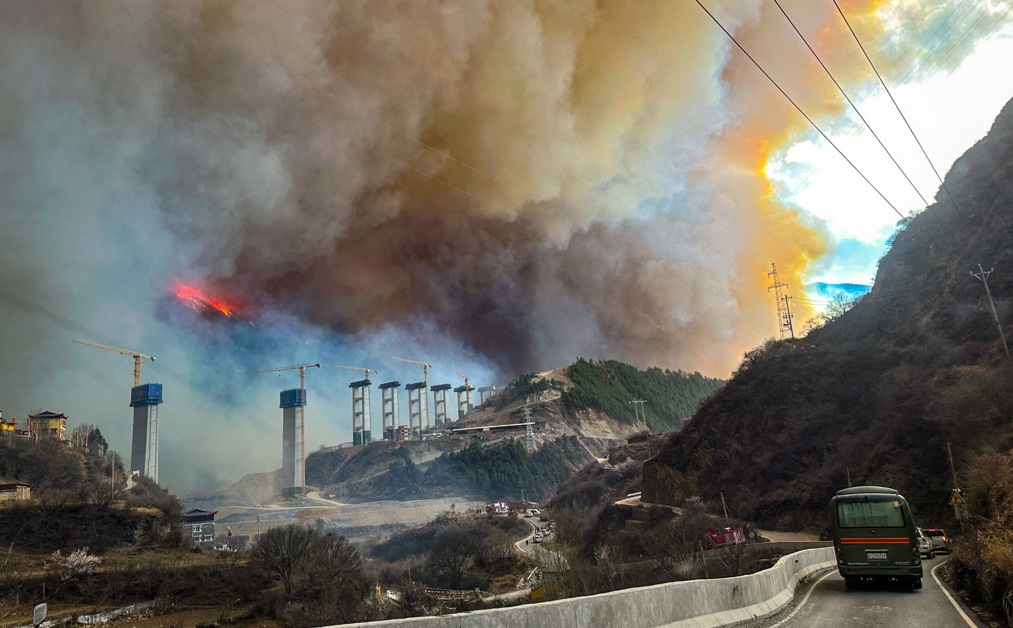 The forest fire in Yajiang county, Sichuan province has spread quickly over several mountain ridges because of strong winds. Photo: Xinhua