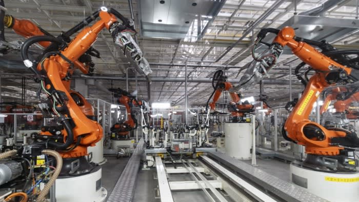 Robotic arms on the production line at the Volkswagen Anhui Automotive Co. factory in Hefei, Anhui Province, China