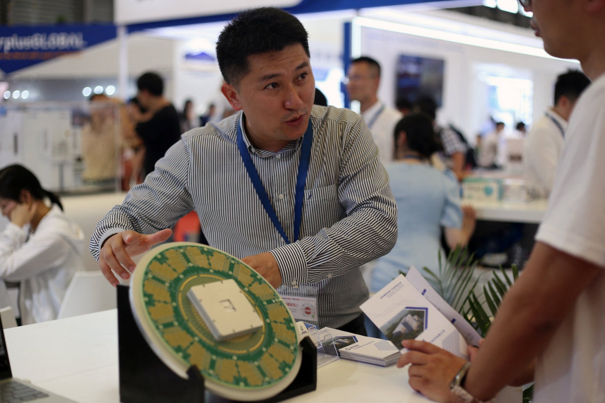 Exhibitors at a semiconductor trade fair in Shanghai. Photo: Reuters