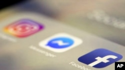 FILE - Social media applications are displayed on an iPhone, March 13, 2019, in New York.