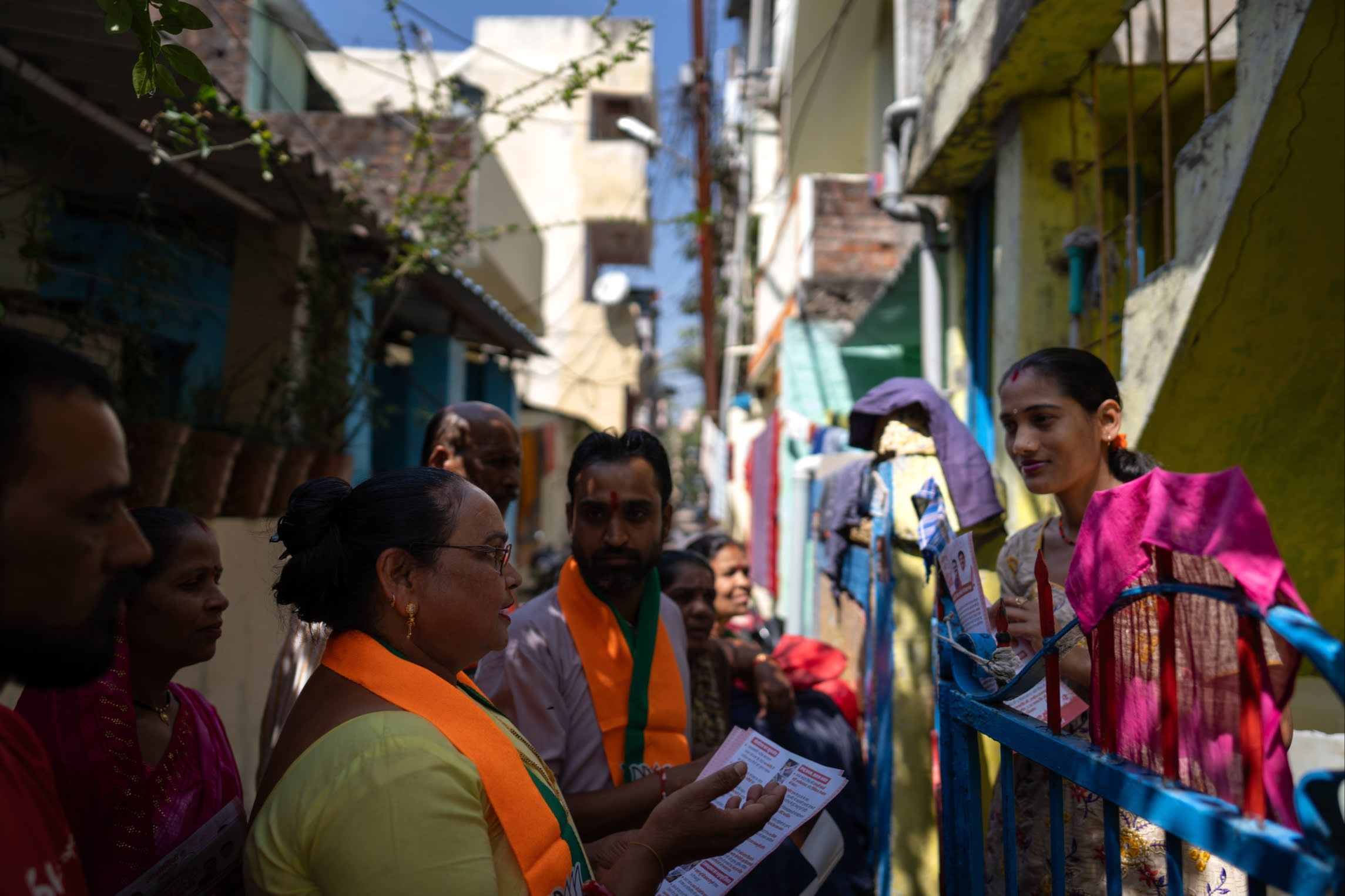 The BJP activists go door-to-door in Bhopal, where they are often joined by party supporters who chant Narendra Modi’s name