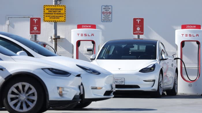 Tesla cars at a charging point