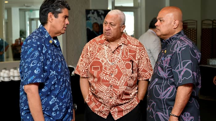 Surangel Whipps, president of Palau, left, Fiji’s prime minister Frank Bainimarama, centre, and David Panuelo, president of the Federated States of Micronesia, at the Pacific Islands Forum in Suva on Tuesday