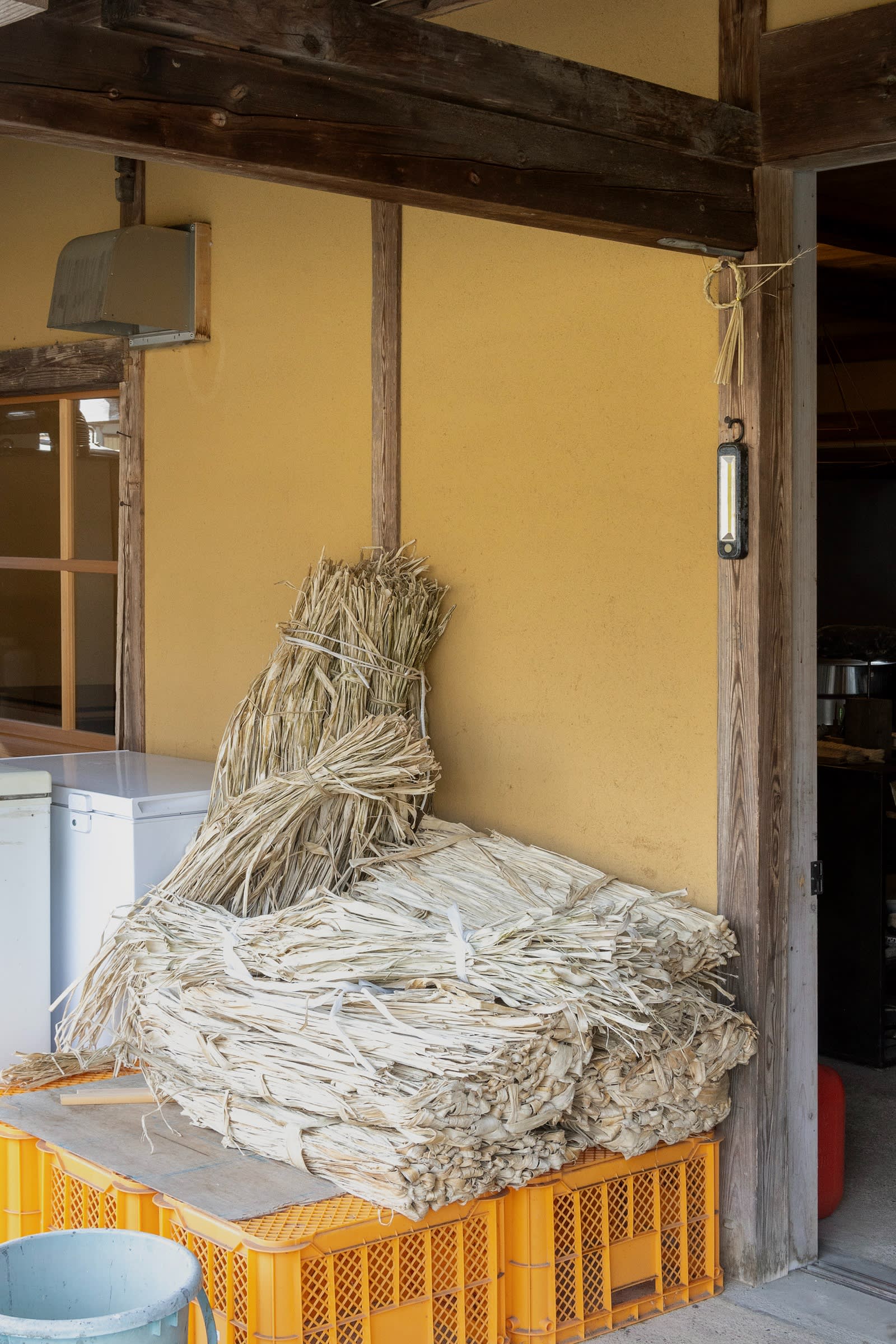 A pile of dried kozo bark to make washi