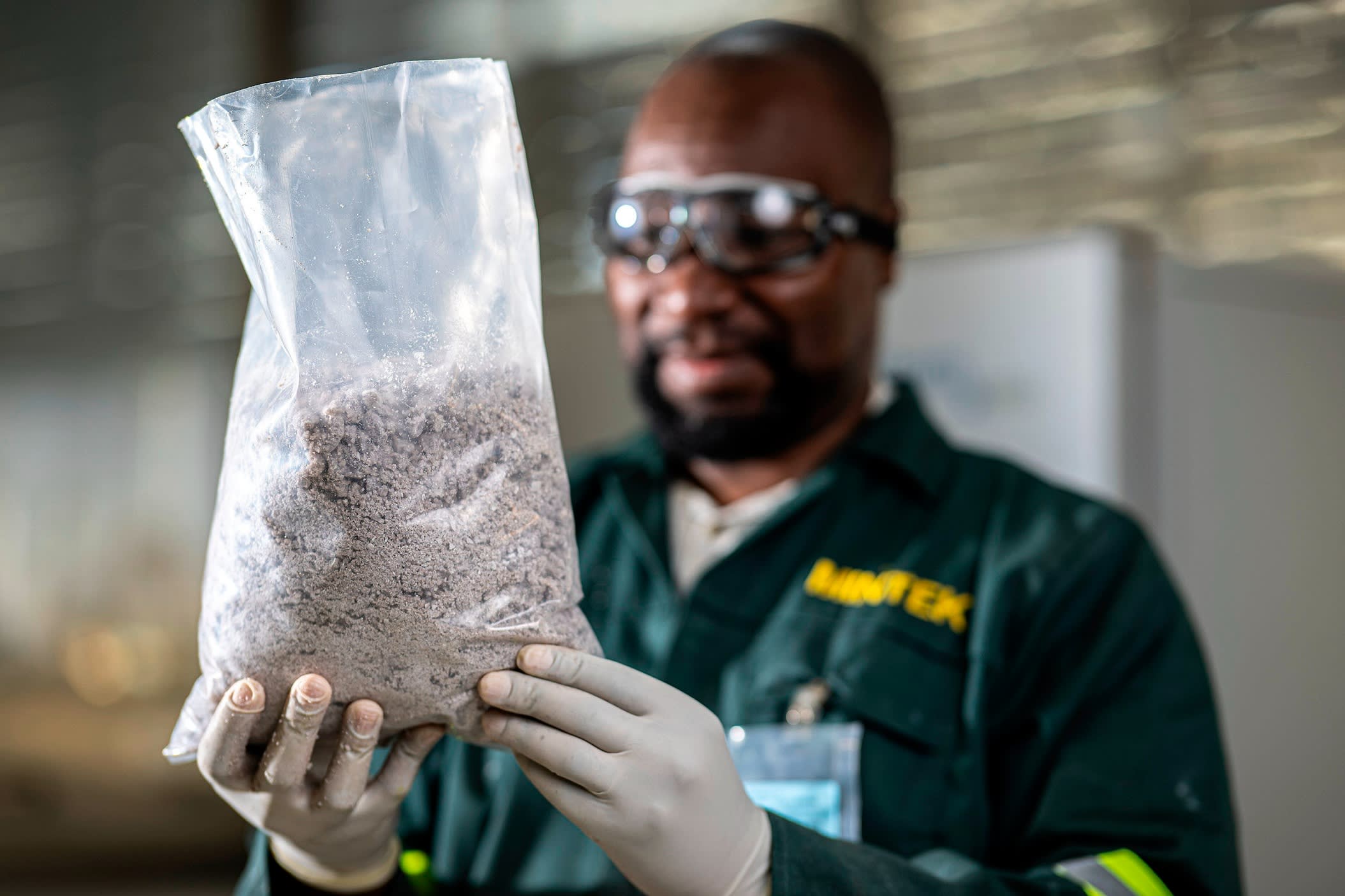A man holding a bag of sulphates