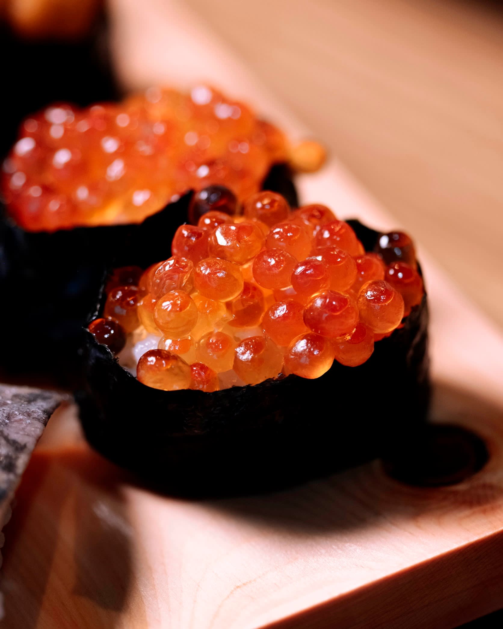 Two pieces of Shimizu’s ikura (salmon roe) gunkan