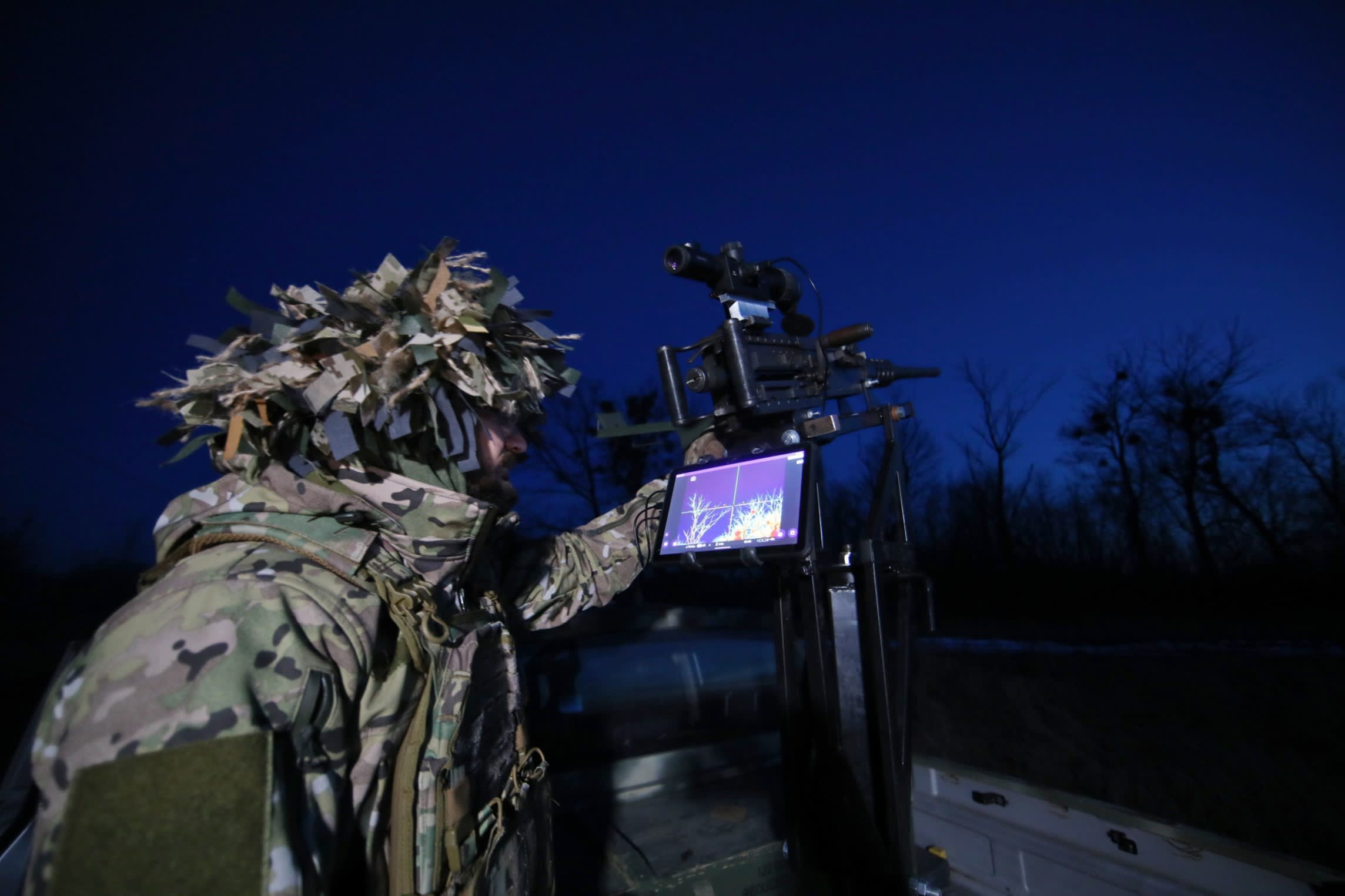 A Ukrainian soldier using a scanner