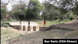 Children play on March 18, 2024, at the proposed starting point of canal construction at Prek Takeo.