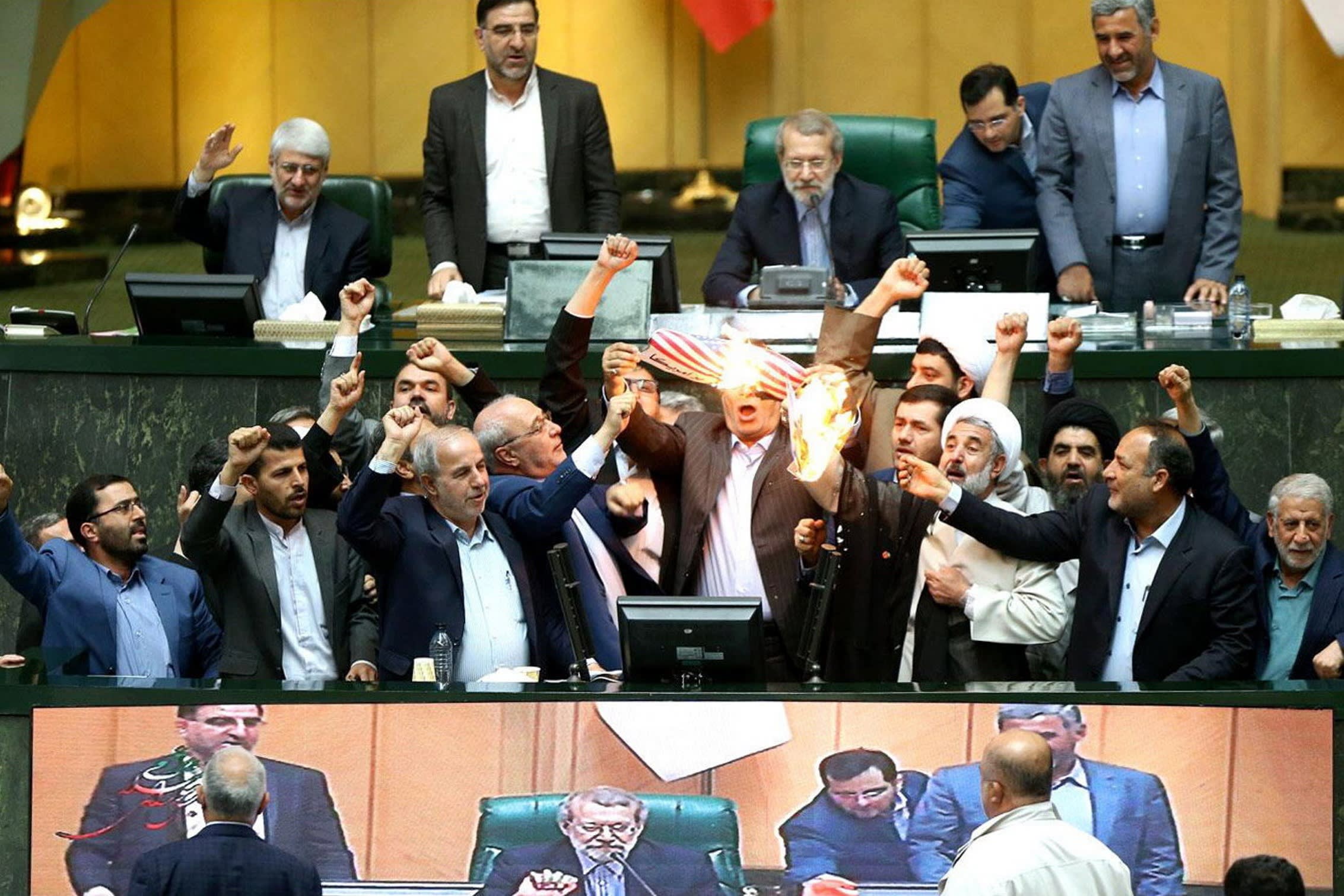 Iranian MPs burn a US flag in 2018. Hardliners prefer to form partnerships with Russia and Chin