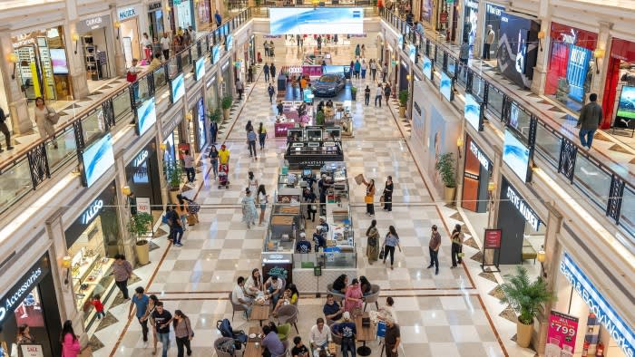 Shoppers at the DLF Promenade mall in New Delhi, India