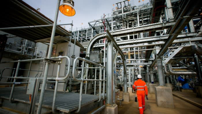 A worker walks through the Curtis Island liquefied natural gas plant