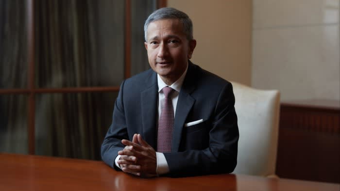Vivian Balakrishnan sitting at a table