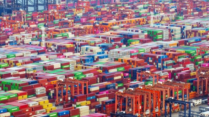 Gantry cranes and shipping containers at Yantian International Container Terminals in Shenzhen, China