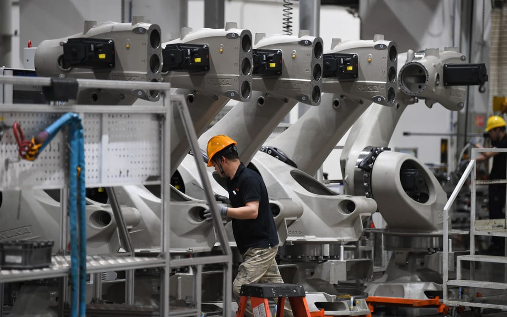 Industrial robots inside a factory at Midea-Kuka Intelligent Manufacturing Science and Technology Park in Foshan, Guangdong province. Photo: Xinhua Industrial robots inside a factory at Midea-Kuka Intelligent Manufacturing Science and Technology Park in Foshan, Guangdong province. Photo: Xinhua