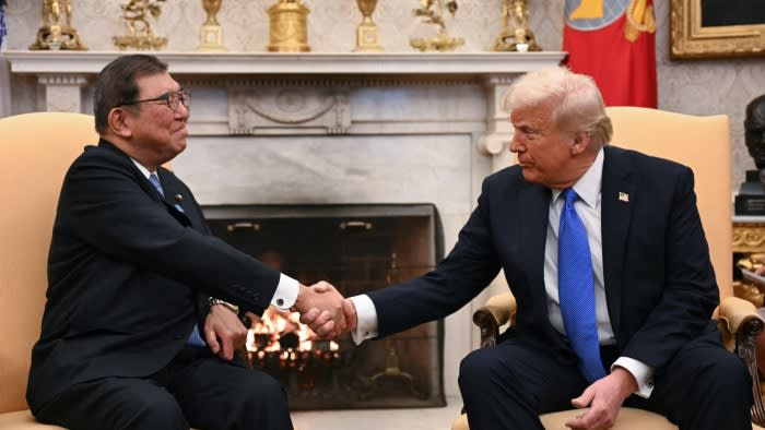 US President Donald Trump, right, shakes hands with Japanese Prime Minister Shigeru Ishiba in the White House, Washington, US in February 2025