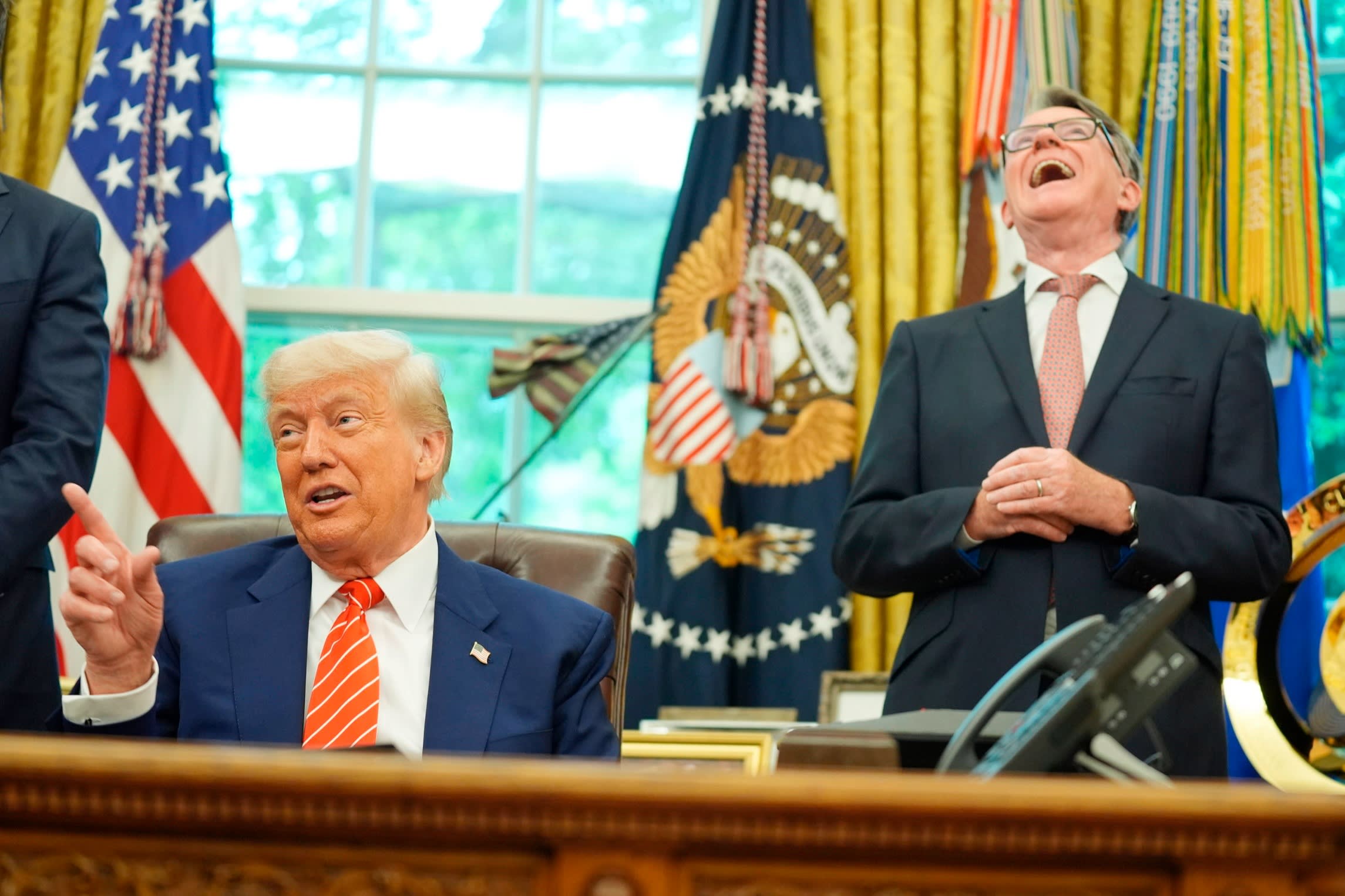 Trump with Britian’s ambassador to the US Peter Mandelson in the Oval Office. The UK has led the way in trying to pacify the US president and managed to clinch an early trade agreement