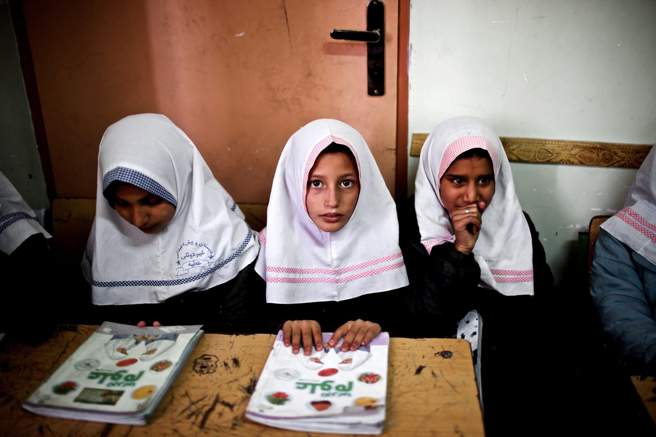 Afghan schoolgirls in class at Shahid Nasseri refugee camp in Taraz Nahid village near the city of Saveh, Iran