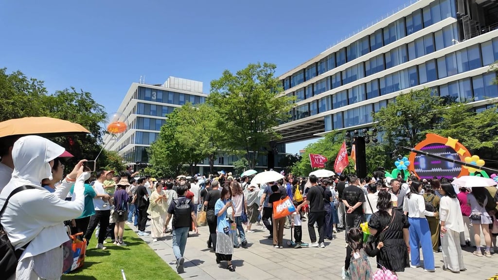 Visitors tour the company’s campus in Hangzhou on AliDay, which features photo booths, mascot parades, matchmaking sessions and other activities. Photo: Wency Chen
