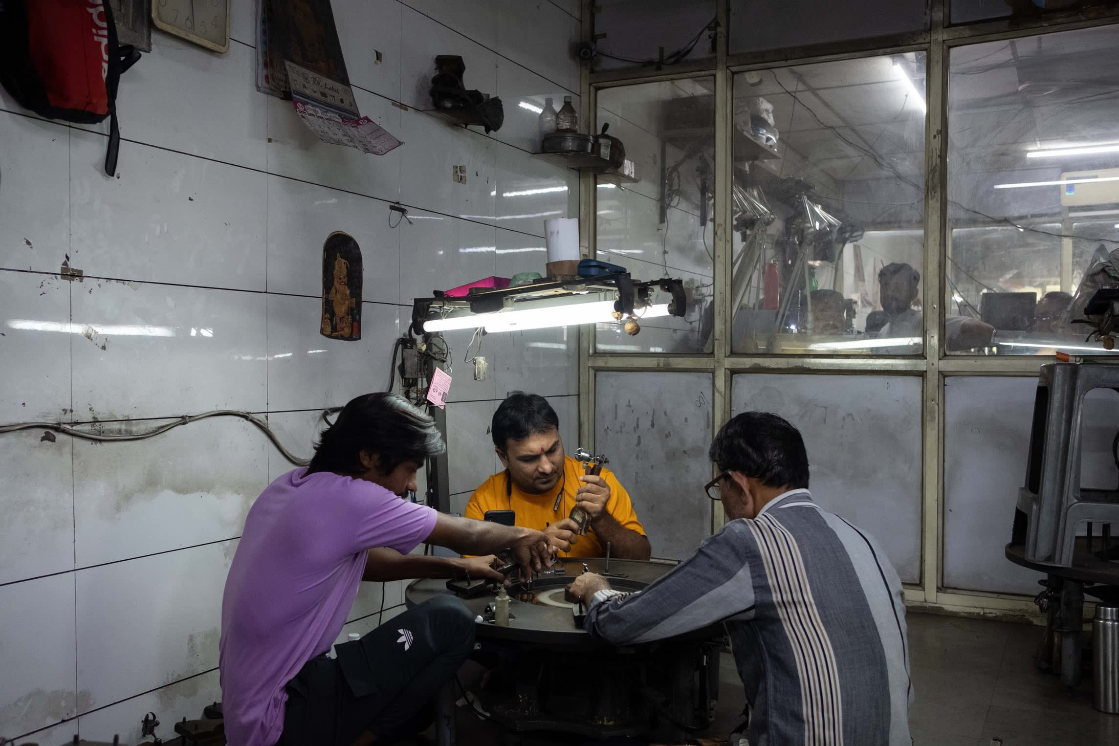 Workers at a diamond processing and polishing workshop in Surat, Gujarat