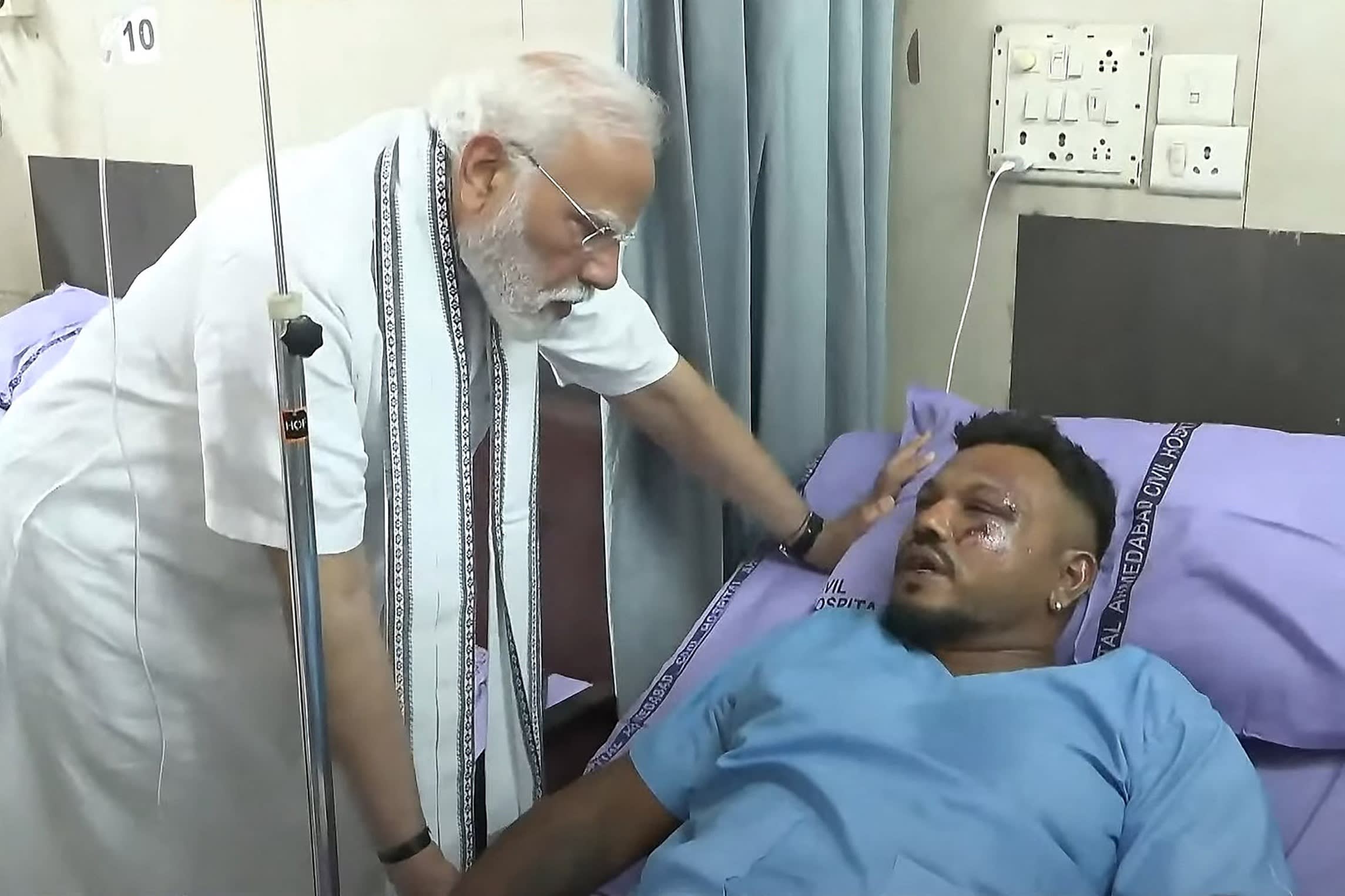 India’s Prime Minister Narendra Modi meeting Vishwash Kumar Ramesh, sole survivor of the Air India flight 171 crash