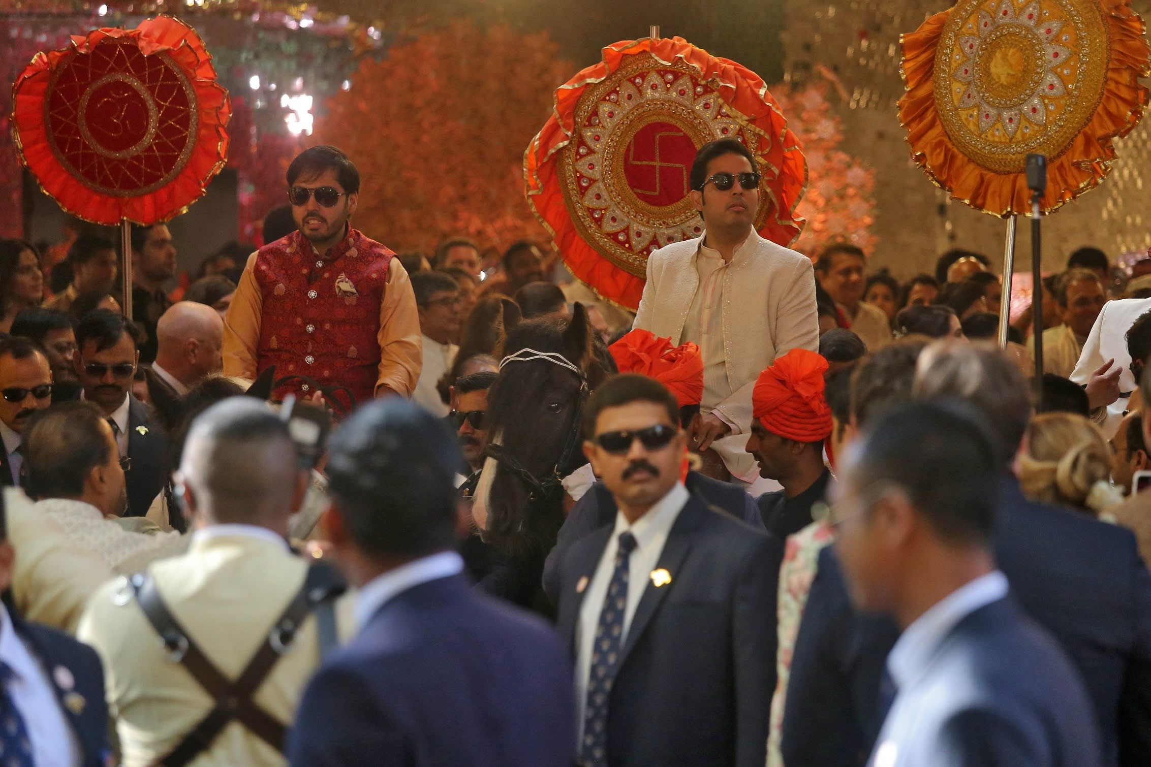 Anant and Akash Ambani ride on black horses in the wedding procession for their sister, Isha