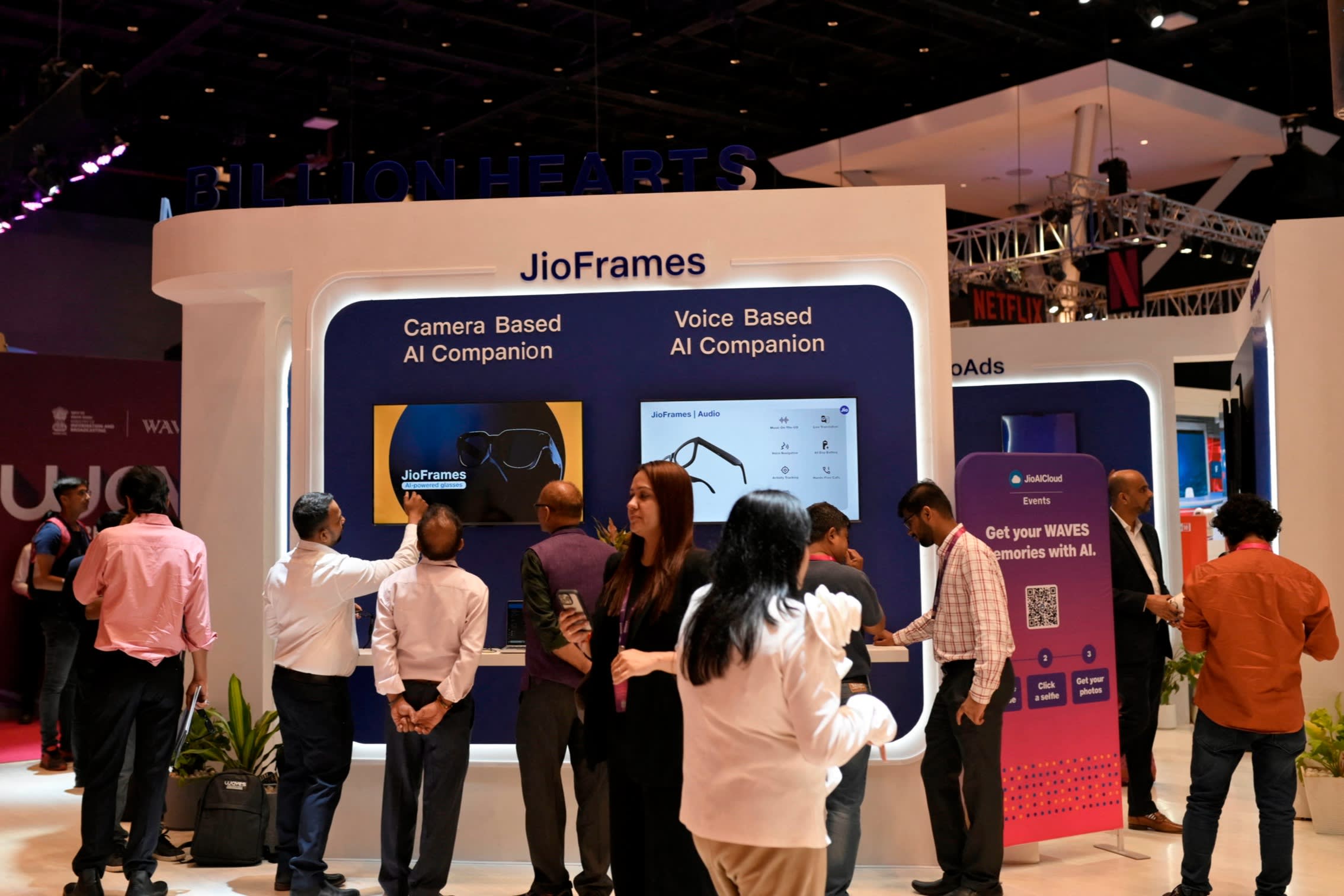 Attendees at the World Audio Visual Entertainment Summit in Mumbai in May visit the Jio Frames exhibition stall