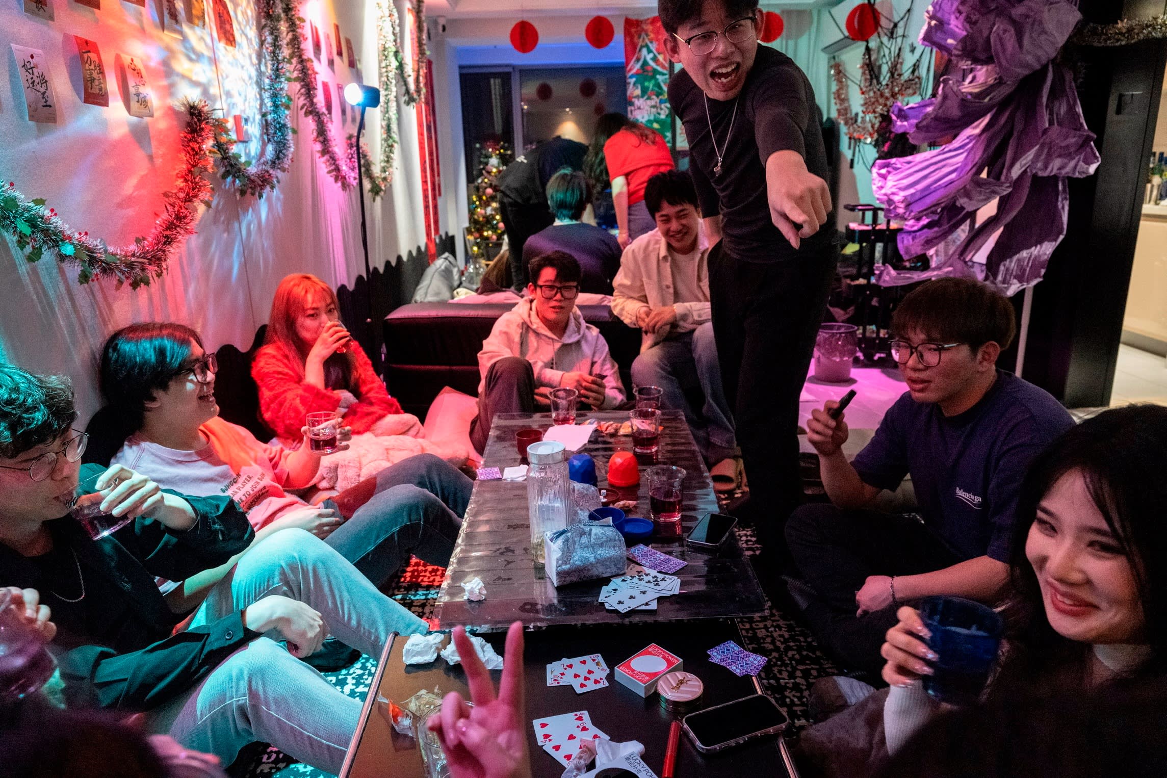 Guests talk and drink at a Beijing homebar