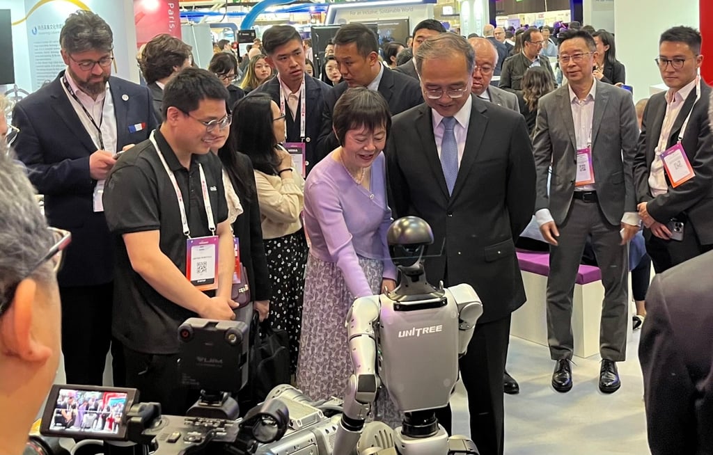 China’s ambassador to France, Deng Li (centre, in suit), tours the China Pavilion. Photo: Xinmei Shen