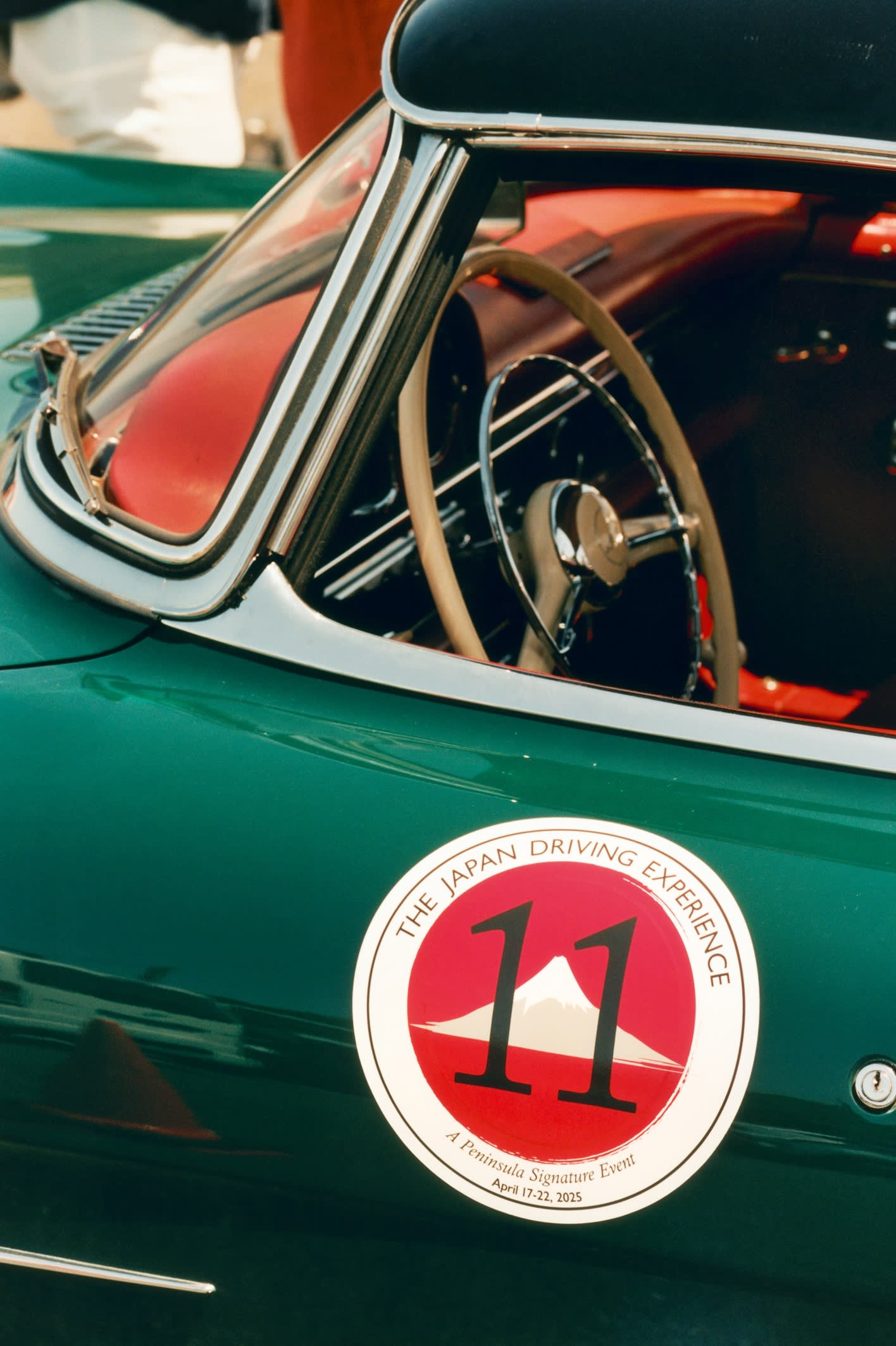 A decal on a 1961 Mercedes-Benz 300 SL taking part in the Peninsula Hotel’s Japan Driving Experience rally