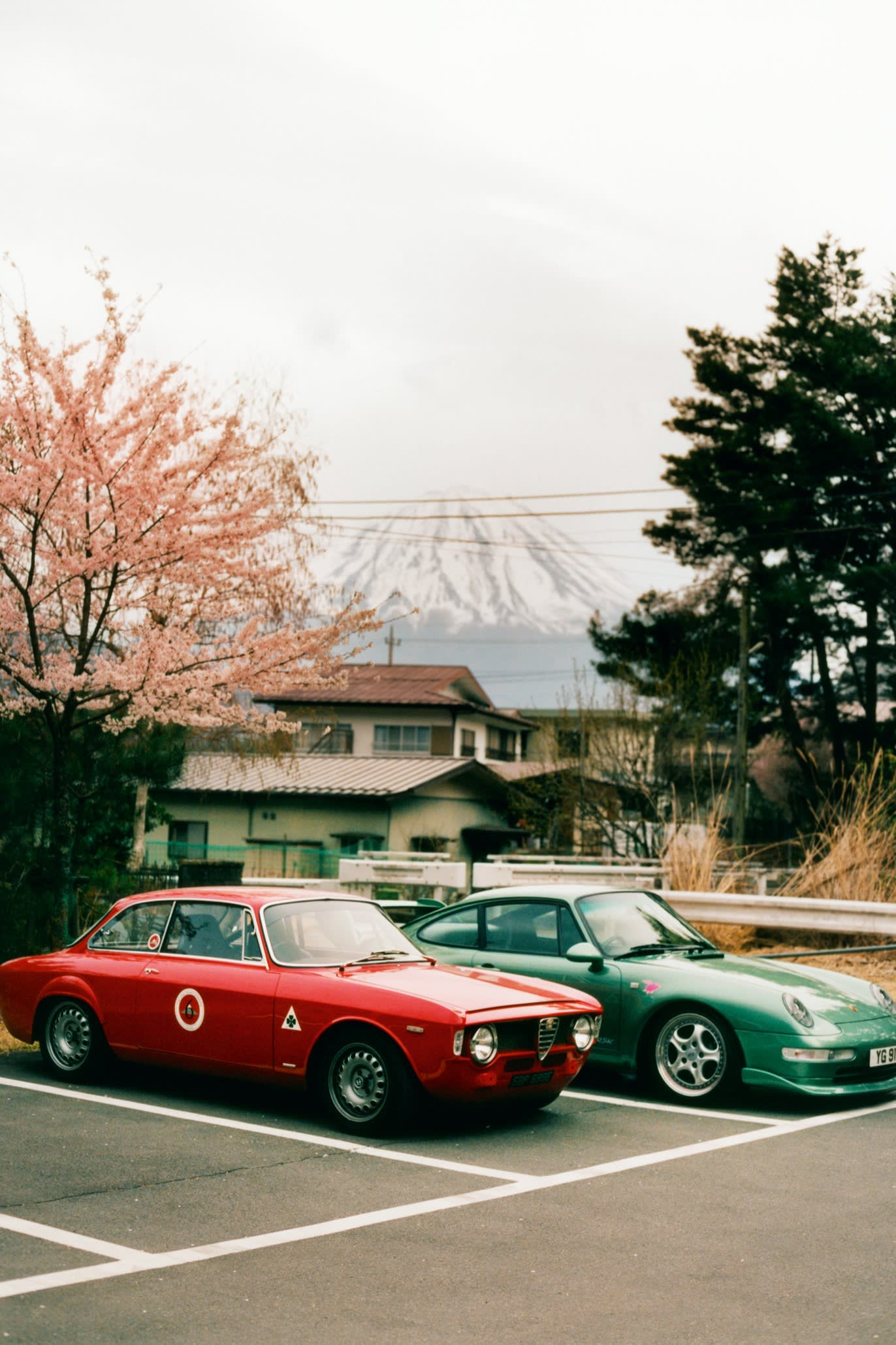 A 1967 Alfa Romeo Giulia 1300GT and a classic Porsche 911