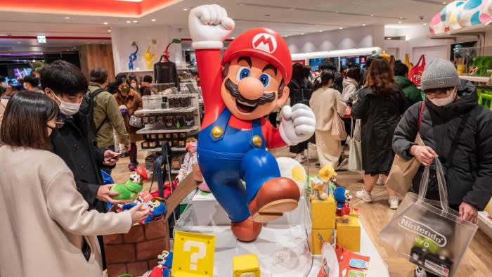 People visit a store of game giant Nintendo in Tokyo