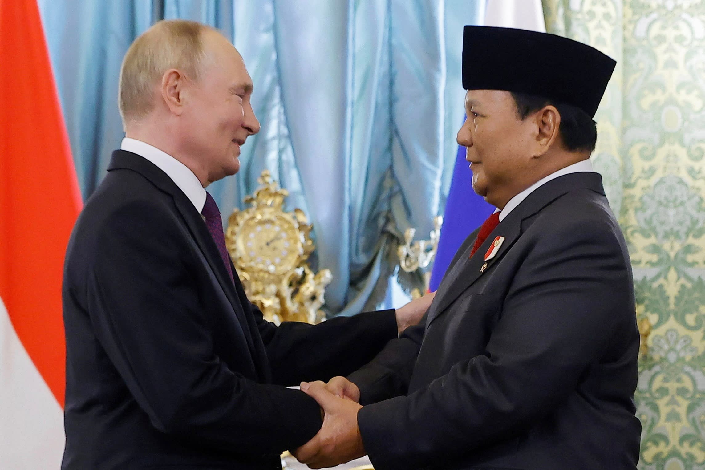 Vladimir Putin shakes hands with Indonesia’s Prabowo Subianto during a meeting at the Kremlin