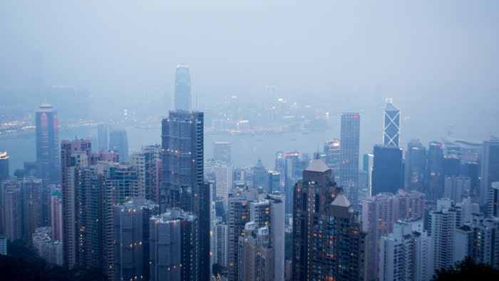 High-rise residential and commercial buildings tower above Victoria Harbour in the Central district of Hong Kong
