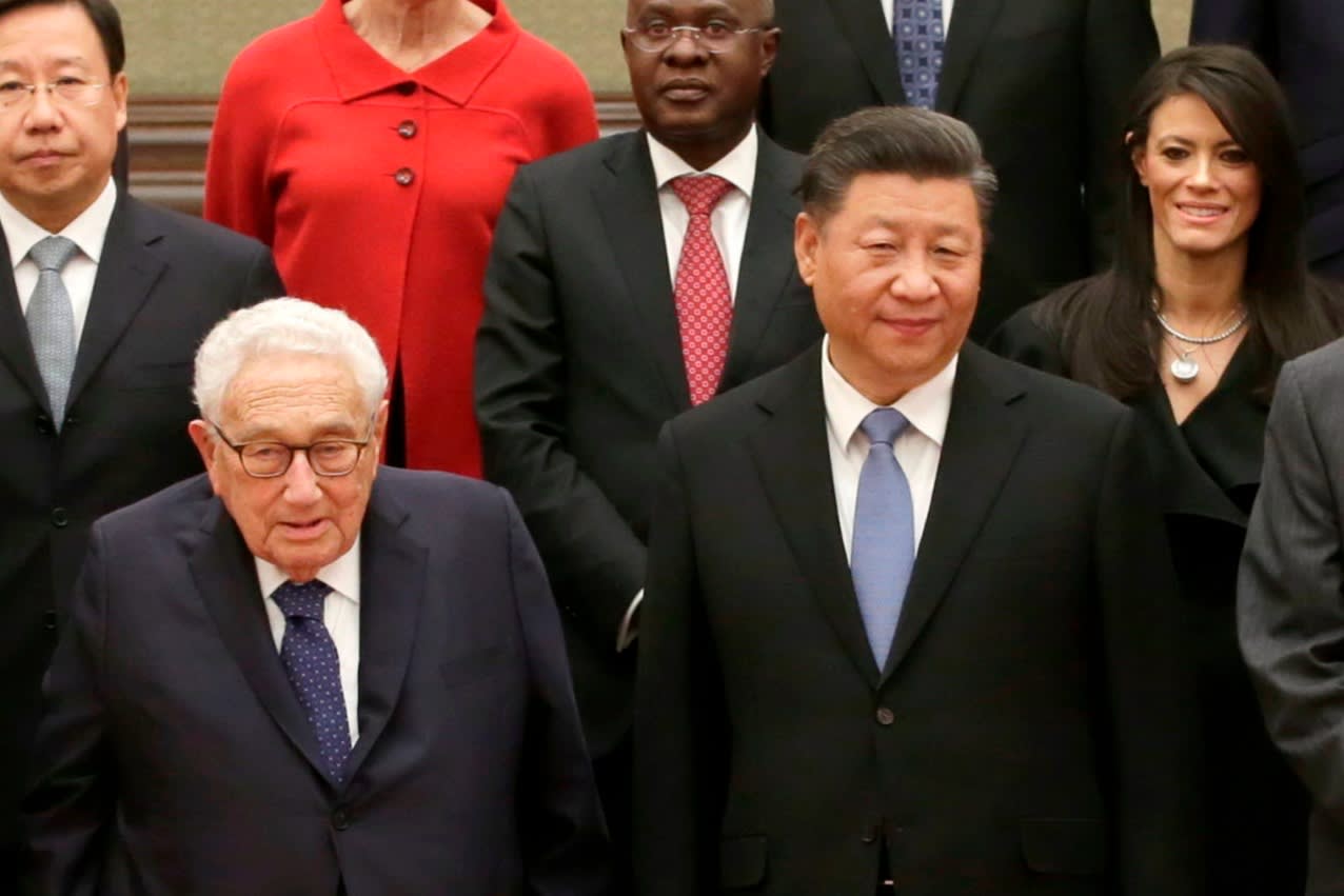 Henry Kissinger, left, and Xi Jinping